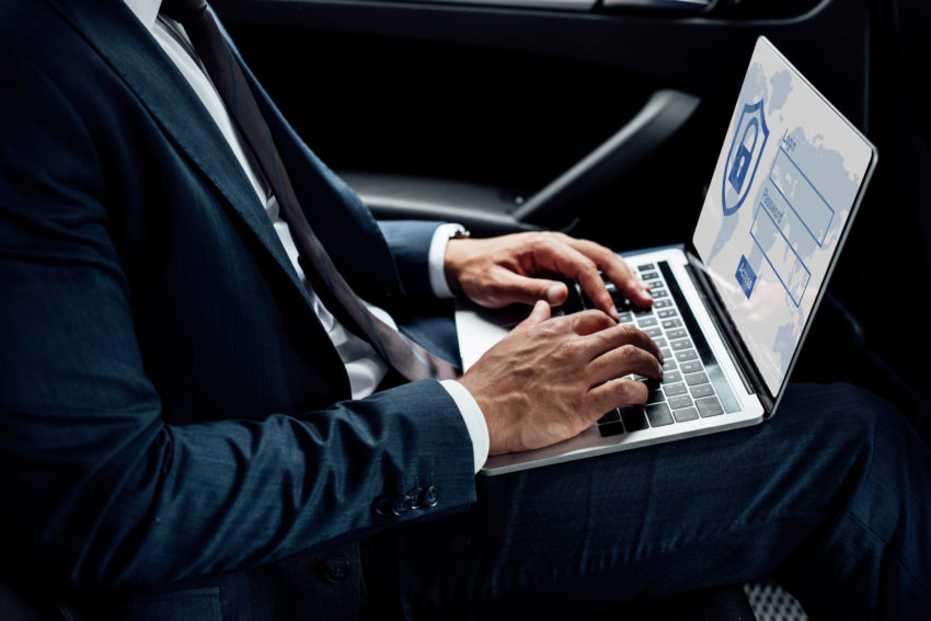 businessman using laptop with internet security